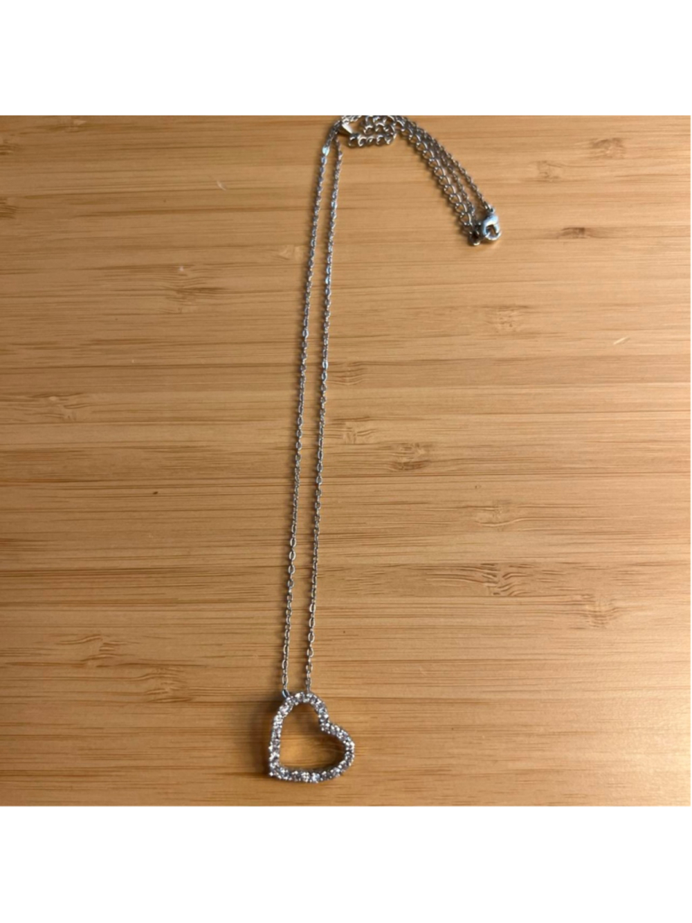 Silver necklace with heart charm filled with cubic zirconia/crystals